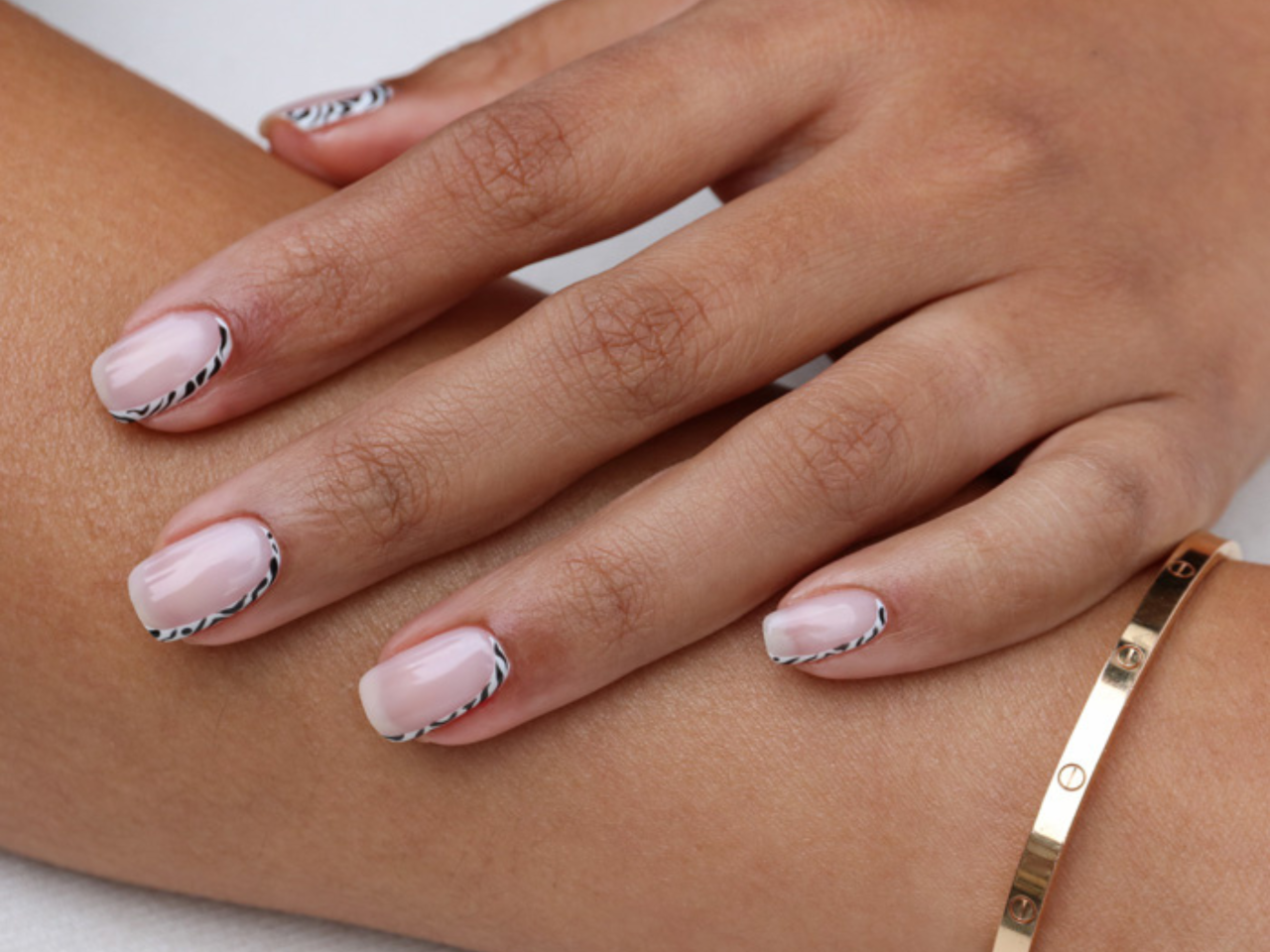 Sheer pink Manicure with a Zebra outline